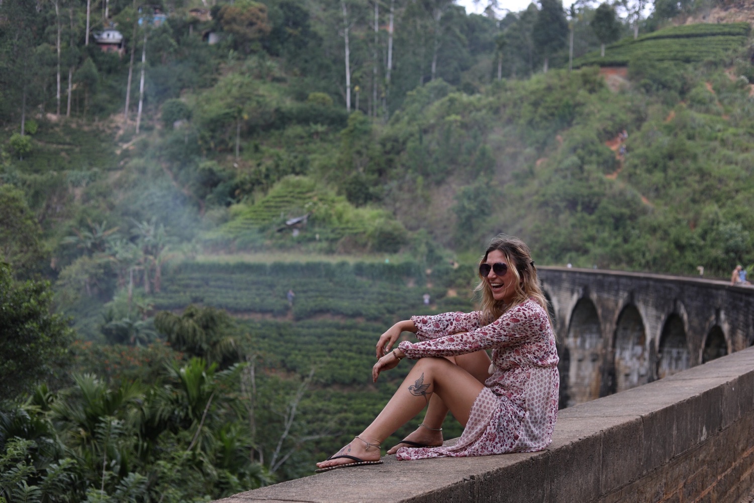 Lola sitting on a bridge during travel